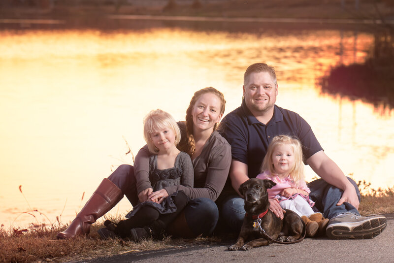 Beautiful sunset family portrait by a lake, captured in Overland Park, Kansas. A timeless example of family photography for Kansas City and Johnson County families.