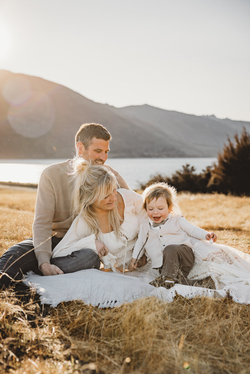 a family posing while having a family photography session in Queenstown