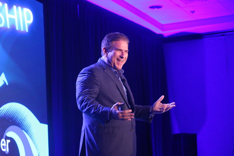 Keynote speaker, Steve Farber, on stage speaking at an event
