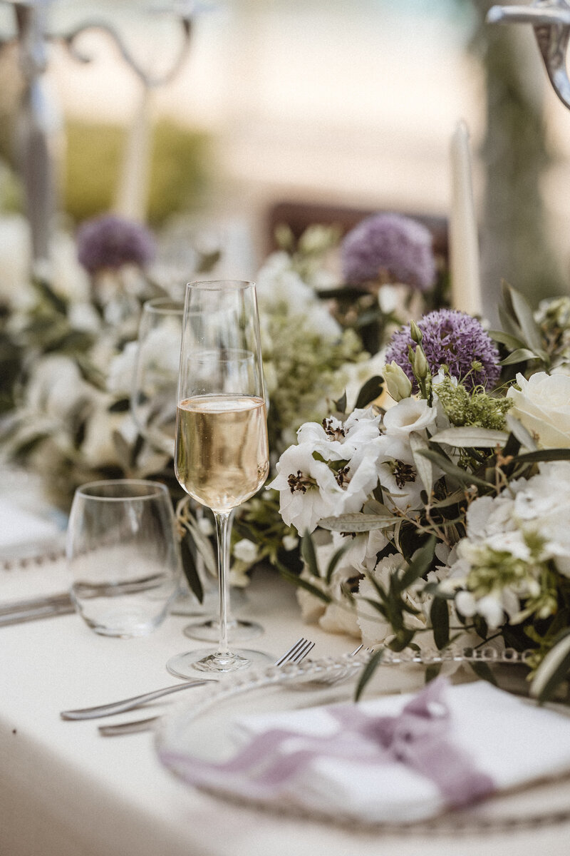 A wine glass sat on the table at Carbis Bay hotel for a wedding