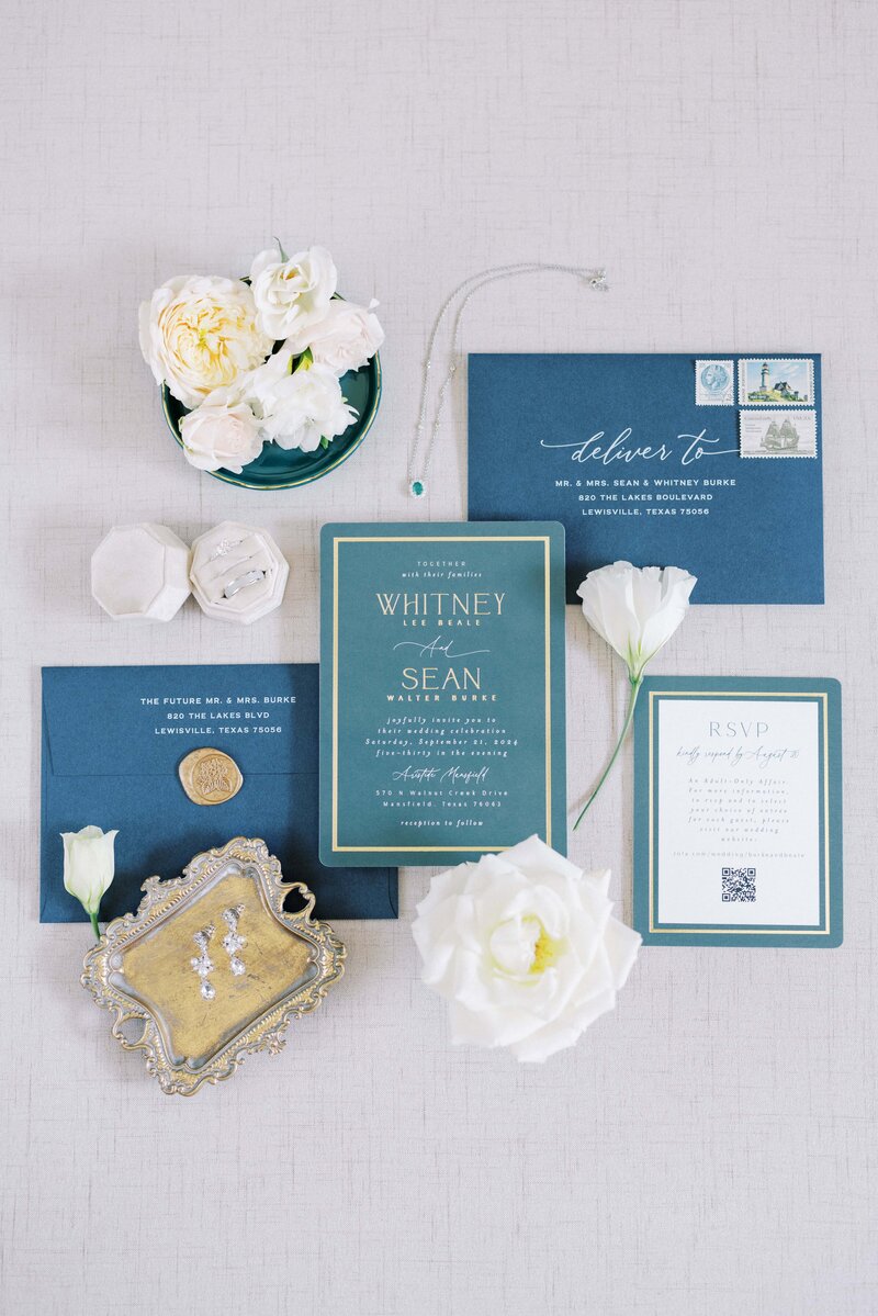 emerald and navy invitation suite flatlay