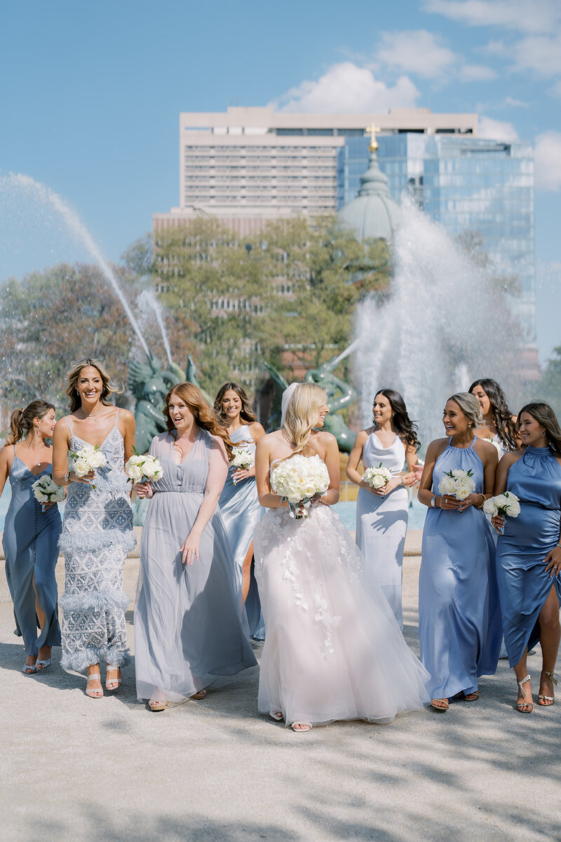A wedding party walks and laughs together in New Jersey