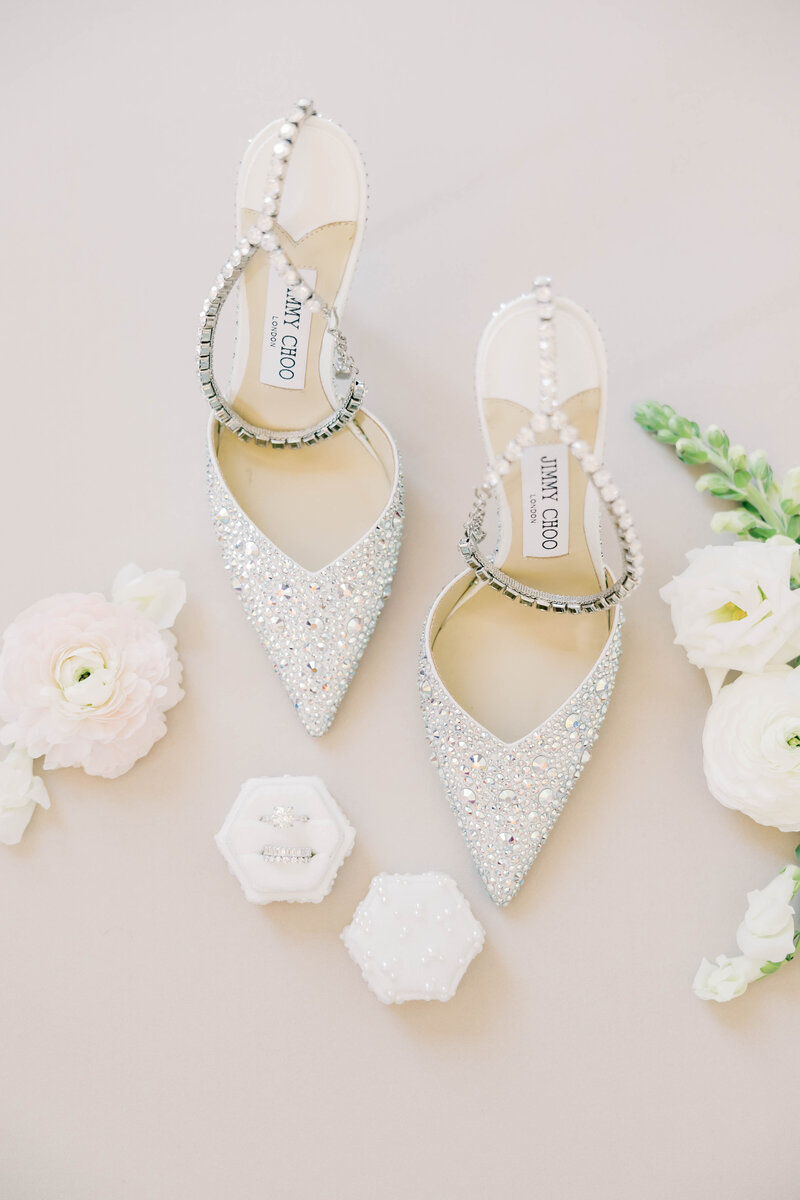 Blue Jimmy Choo shoes with wedding bouquet.