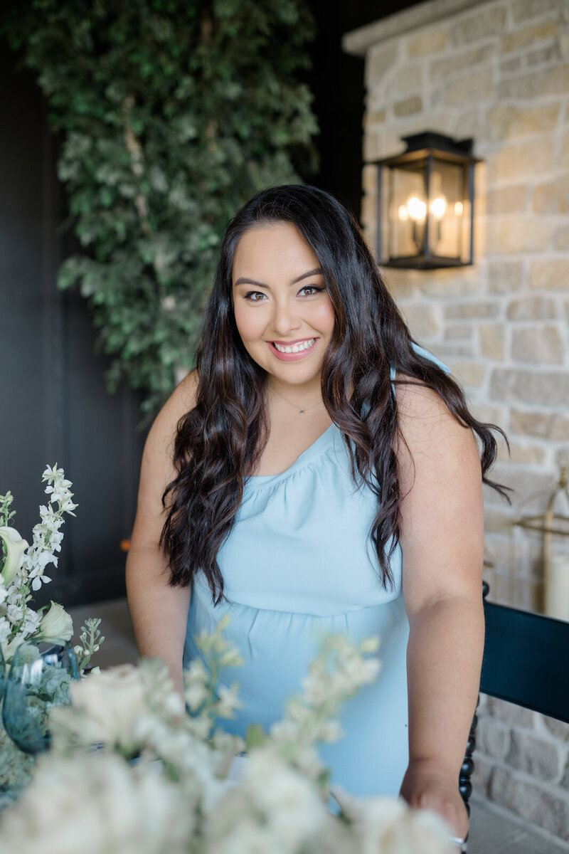 Keyla Alanes a business owner in a light blue dress