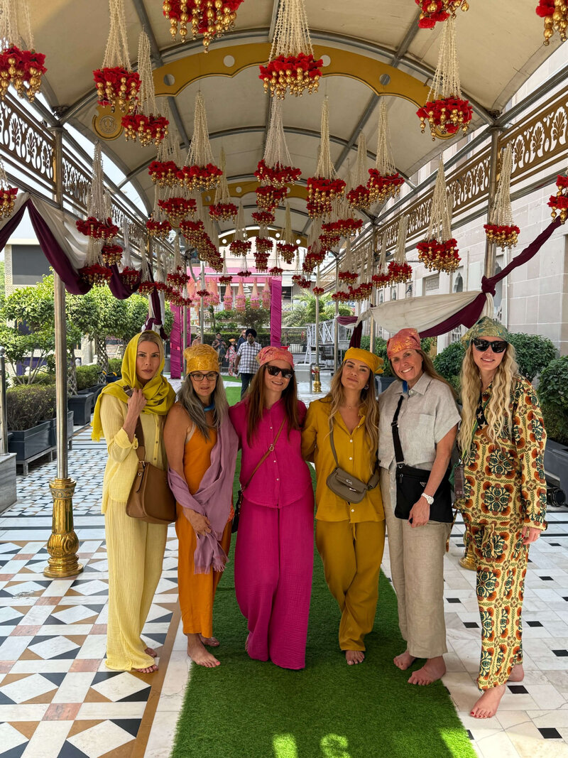 Group of female travelers brightly dressed in traditional Indian wear