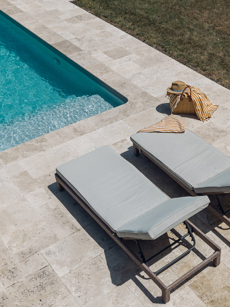 Outdoor swimming pool with luxury loungers at Chateau Charente painting retreat