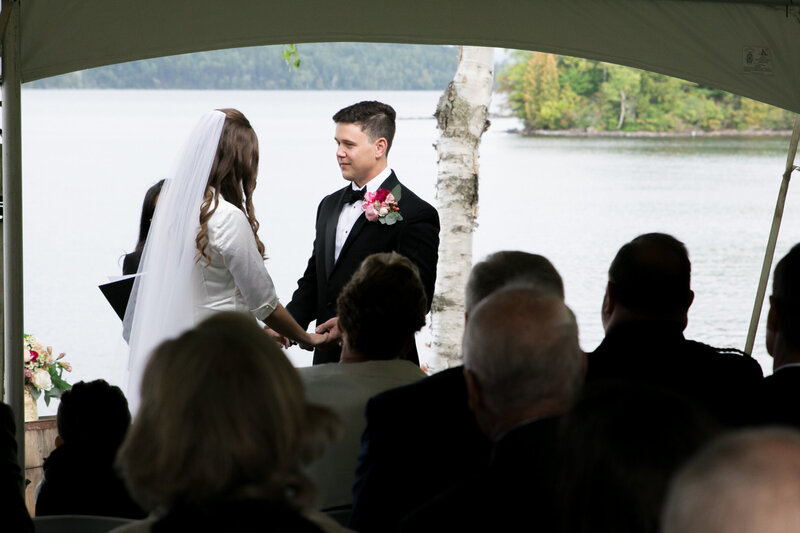 Bride and Groom holding hands during ceremony | Wedding Photography