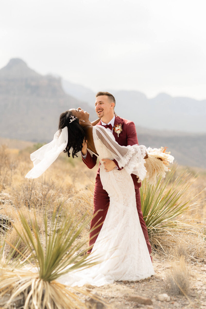 Couple embracing and laughing at their Big Bend elopement