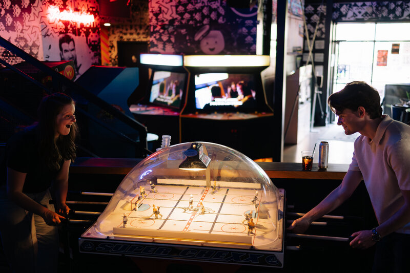 couple plans air hockey