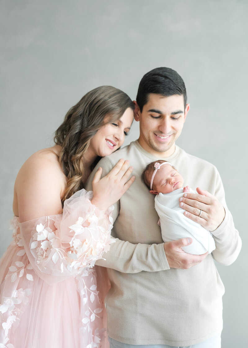In-studio Maternity Session with floor floral arrangments for mother's day minis photoshoot
