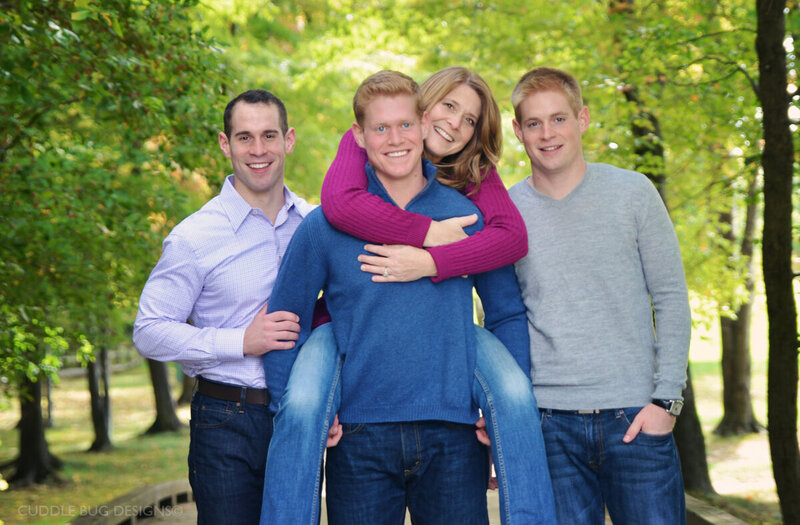 mom and three sons, mom on sons back in the park