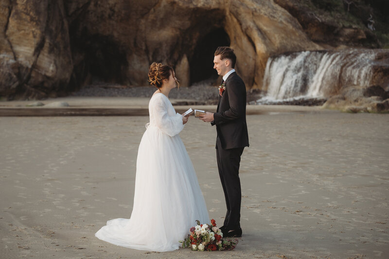 Bride and Groom exchanging vows on Canon beach in Oregon 