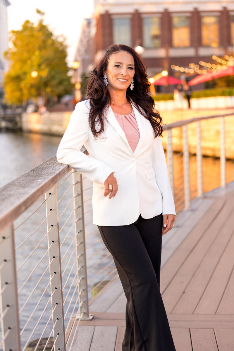 Woman with White Coat for Health & Wellness Branding Shoot Woman with Brown Hair Outdoor Lighting