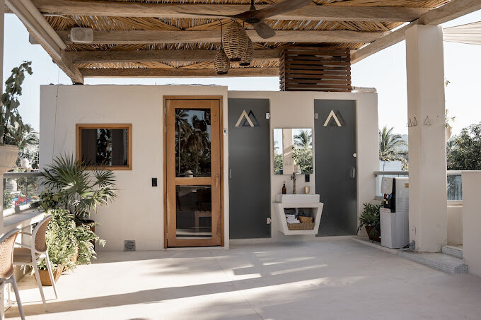 Alchemize House is a community wellness studio in Sayulita offering cold plunge, sauna, co-working, and a variety of classes including yoga, Pilates, breathwork, and sound healing.