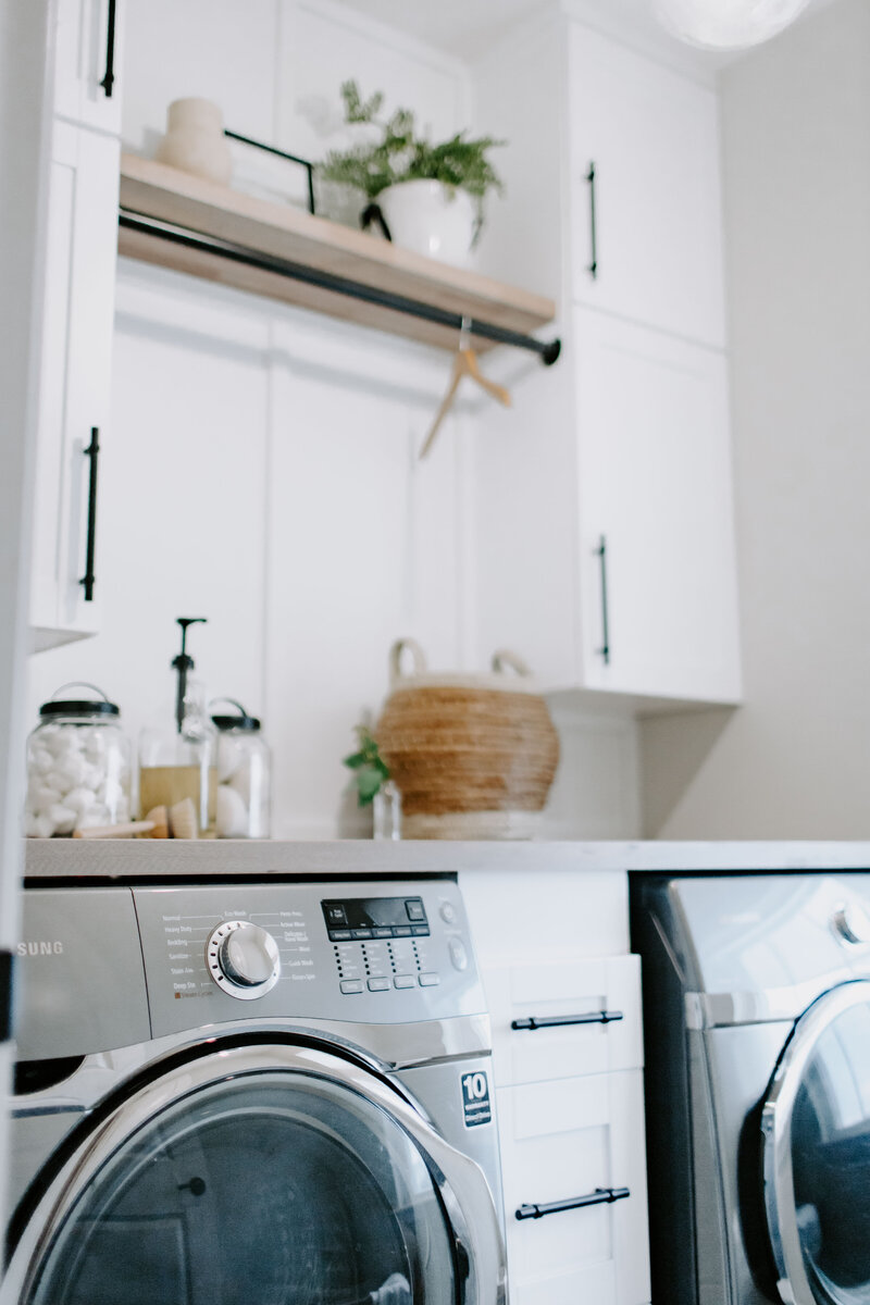Efficient and elevated laundry room with custom storage, clean finishes, and design-forward functionality.
