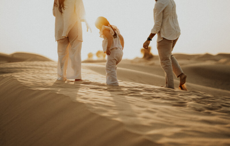 a family of three in the desert