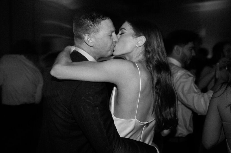 Bride and Groom kiss on the dance floor during their wedding at Royal Palms in Phoenix Arizona