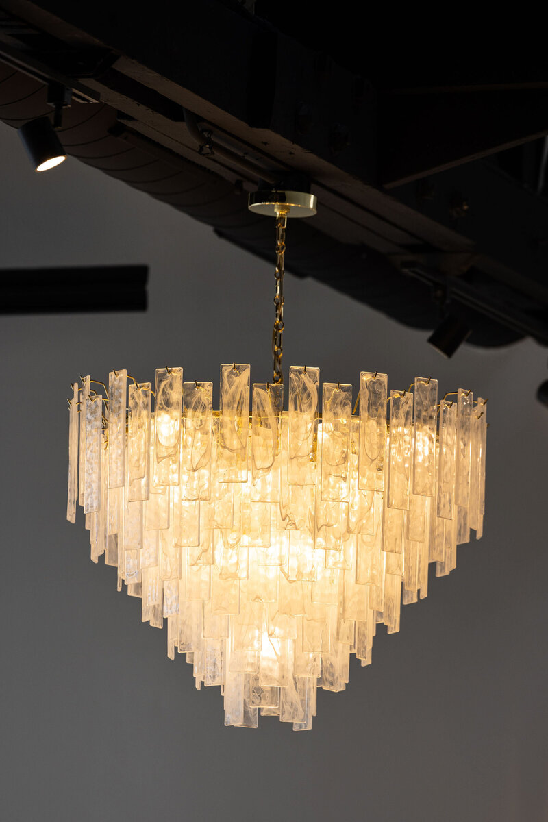 large detailed crystal chandelier accent in luxury venue space
