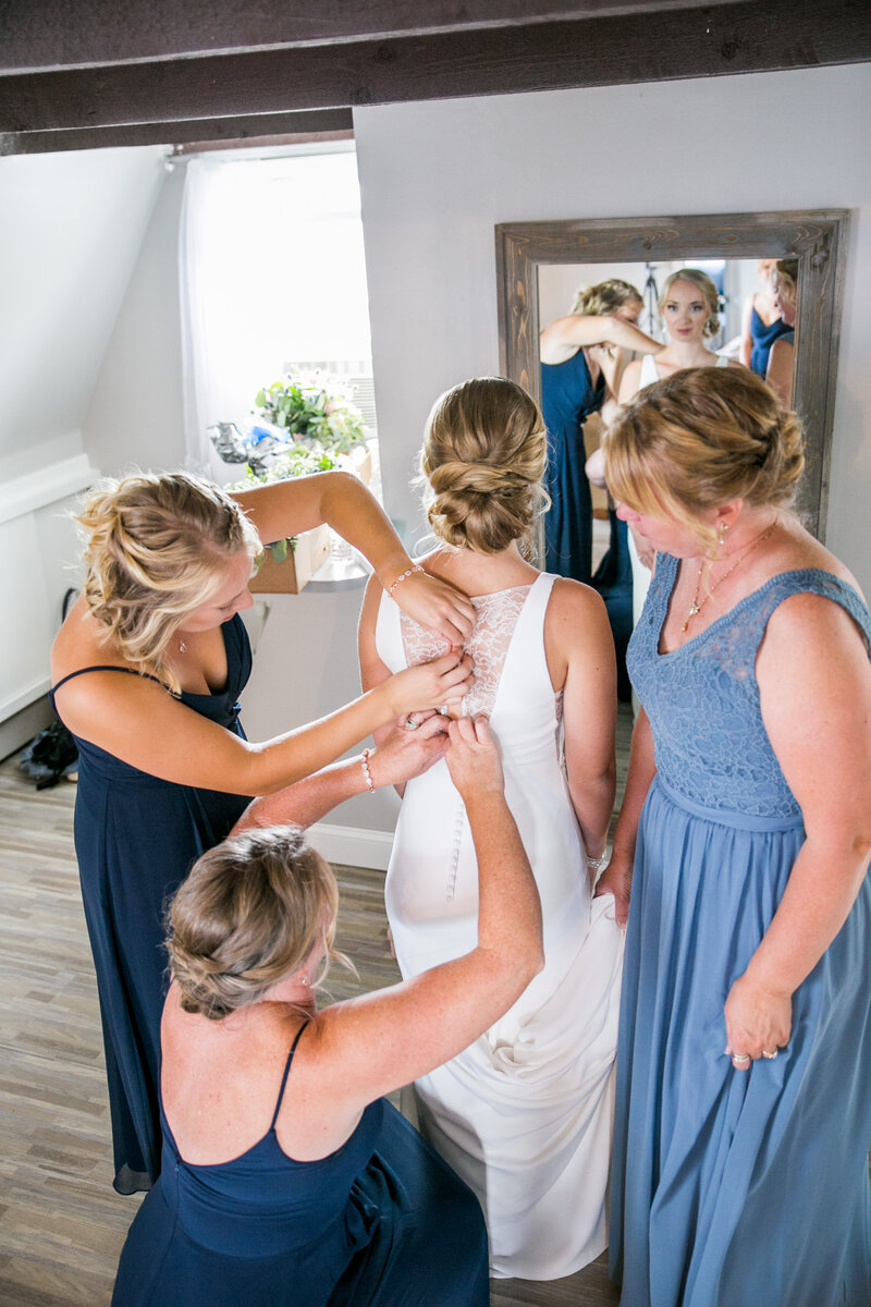 Bridesmaids helping bride with dress | Harmony, Maid Wedding