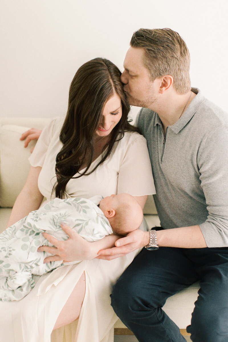 dad kissing moms temple by NWI photographers