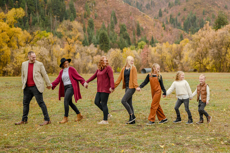 utah family photographer of family posed at the poppy field at lambert park in alpine utah 