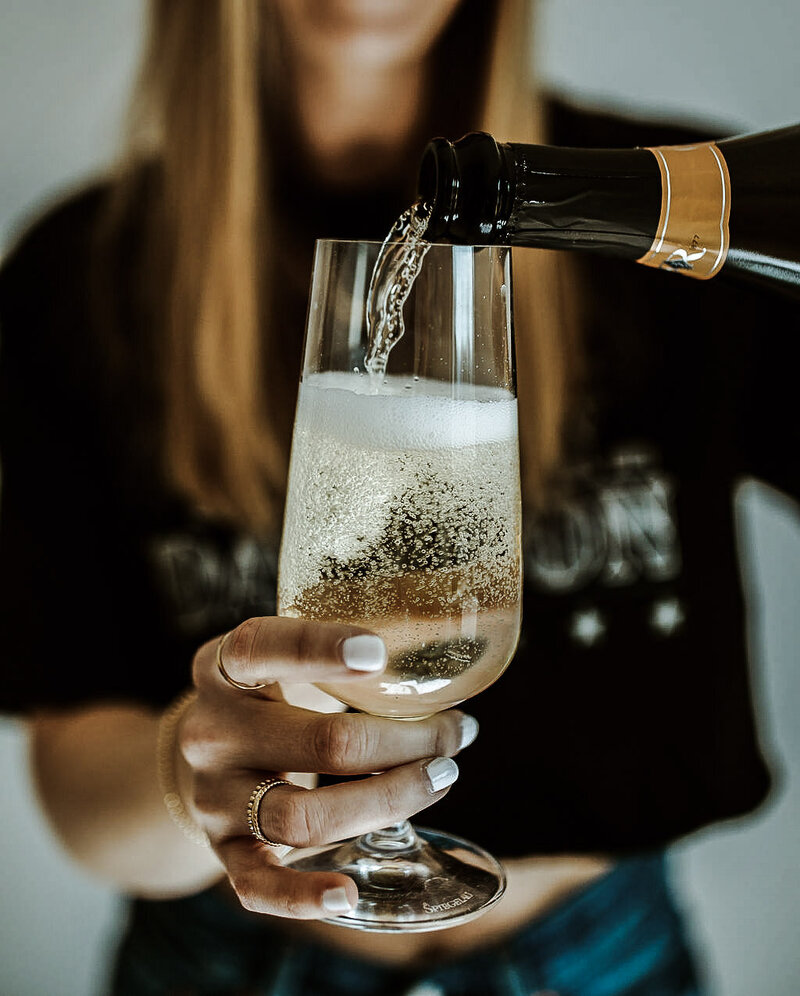 Woman pouring champagne