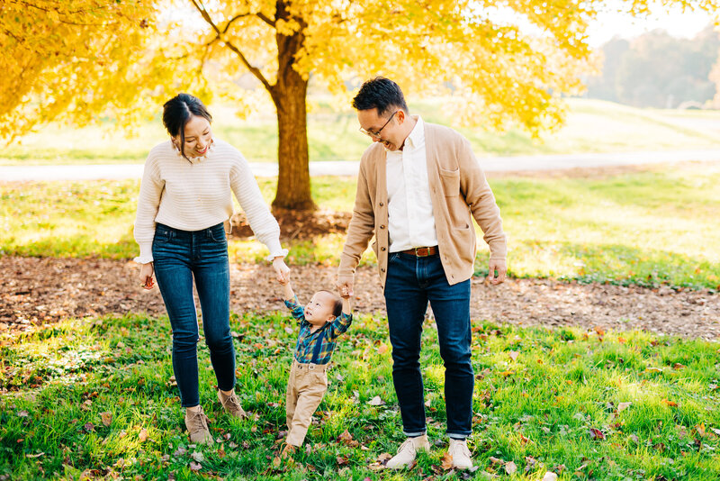 Family laughing and walking through River Farm in Alexandria, VA