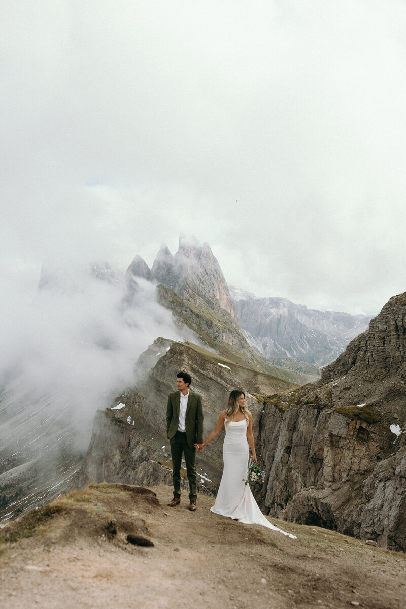 Couple enjoying their wedding day moments under Italy’s vast sky in the Dolomites.