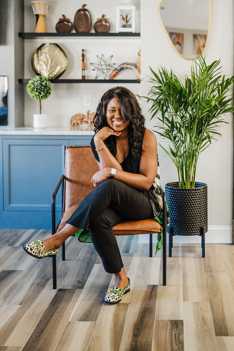 interior designer laughs into camera during in home photoshoot