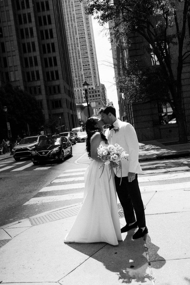 Bride & groom kiss on Philadelphia street corner