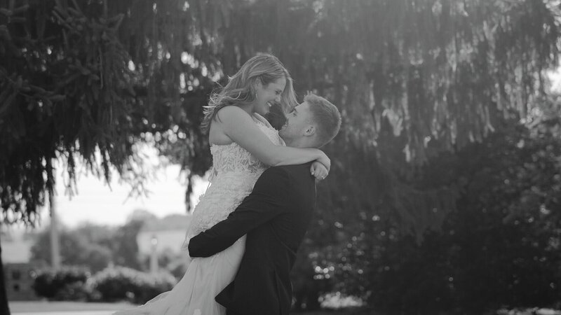 A groom picking up and spinning his bride in a Pennsylvania farmhouse wedding film - Films by Brian