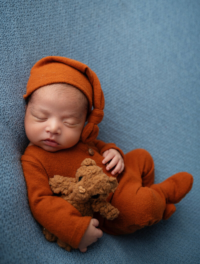 newborn baby with teddy bear