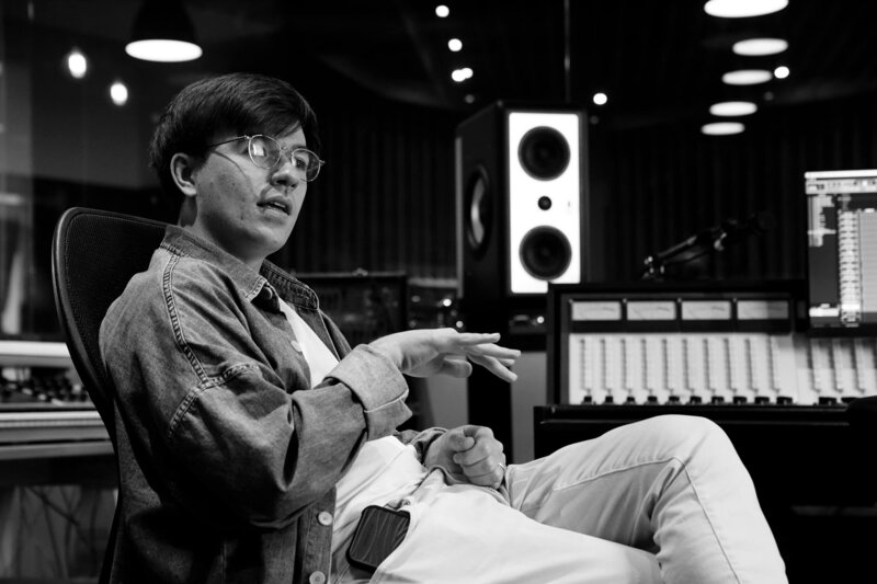 Producer songwriter Jacky Levare working in music studio
