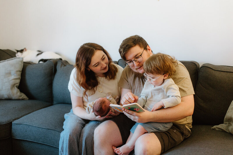 Couple posing in their home during an in home newborn photoshoot