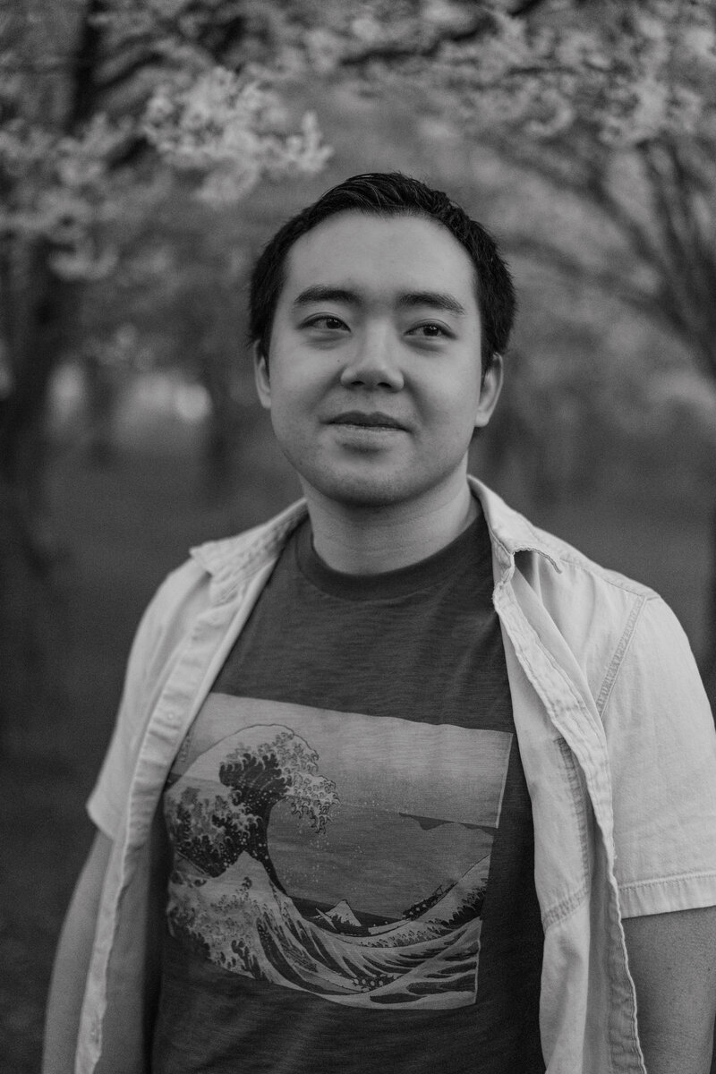 Self-portrait on a blank wall with shadows