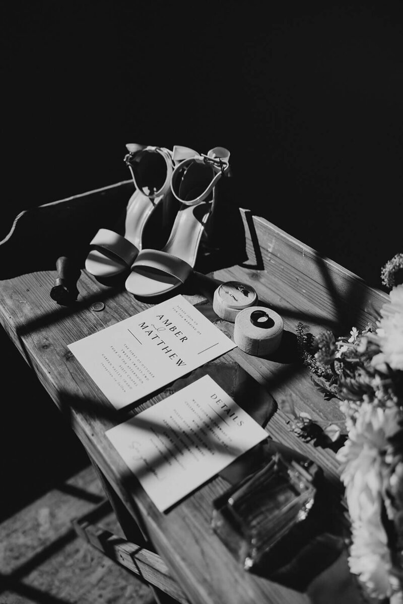 Wedding details including invites and shoes representing the diversity of bridal show vendors at the crush collective expo.