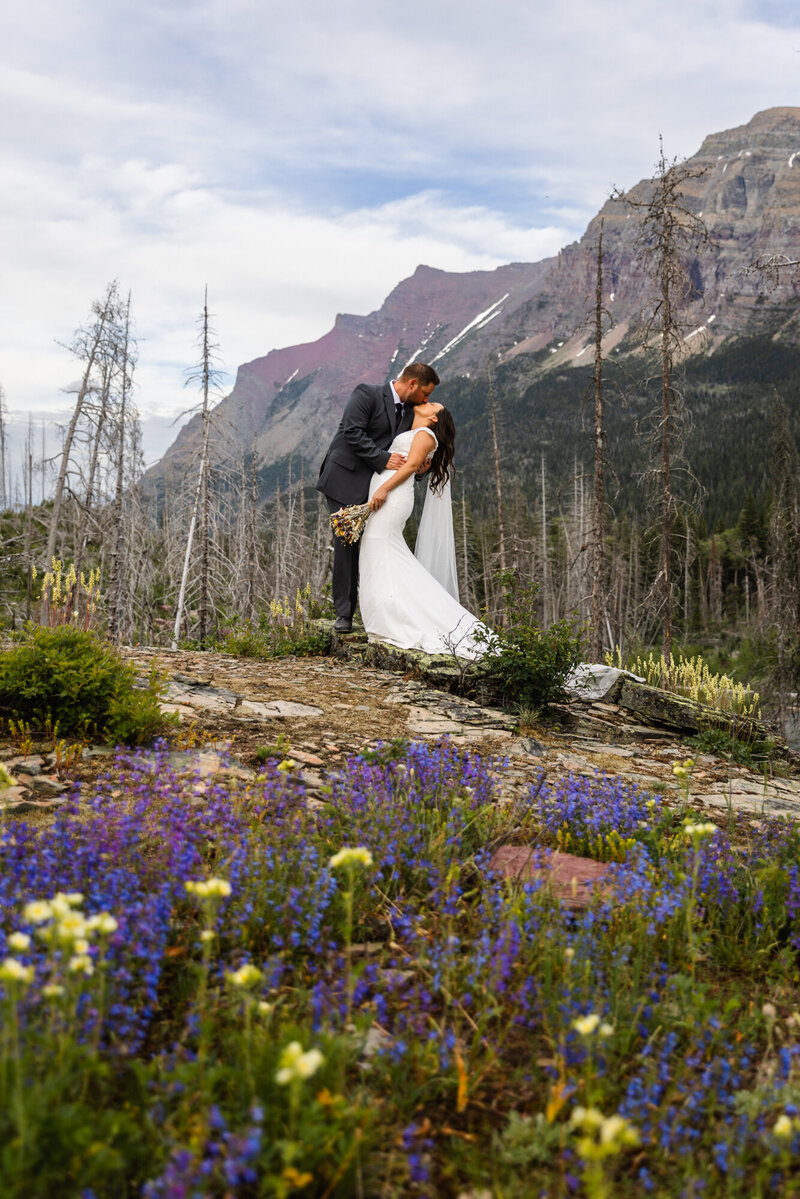 groom holding up bride