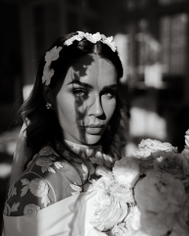 A timeless black and white bridal portrait at The Olana in Hickory Creek, Texas, capturing an elegant bride in a luxurious wedding setting