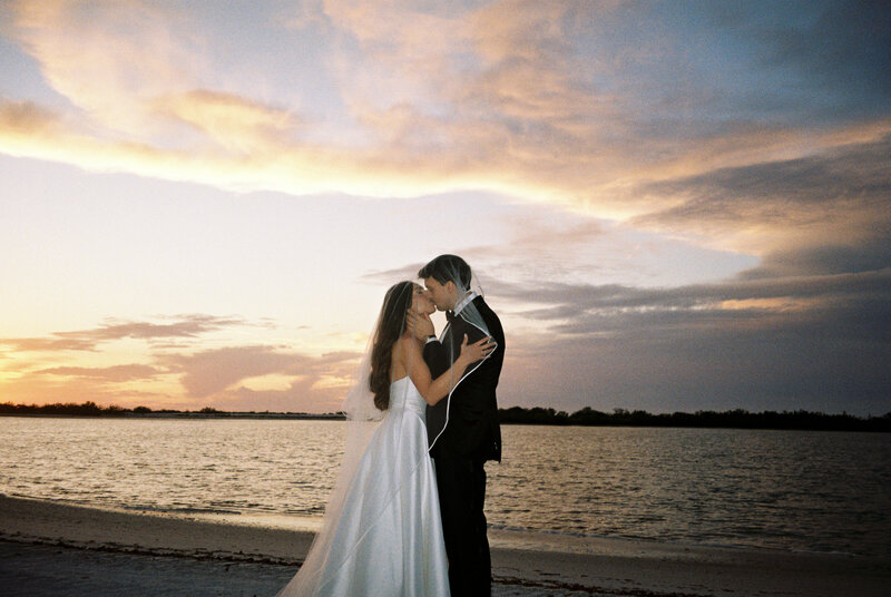 bridal party popping champagne by wedding videographer tampa
