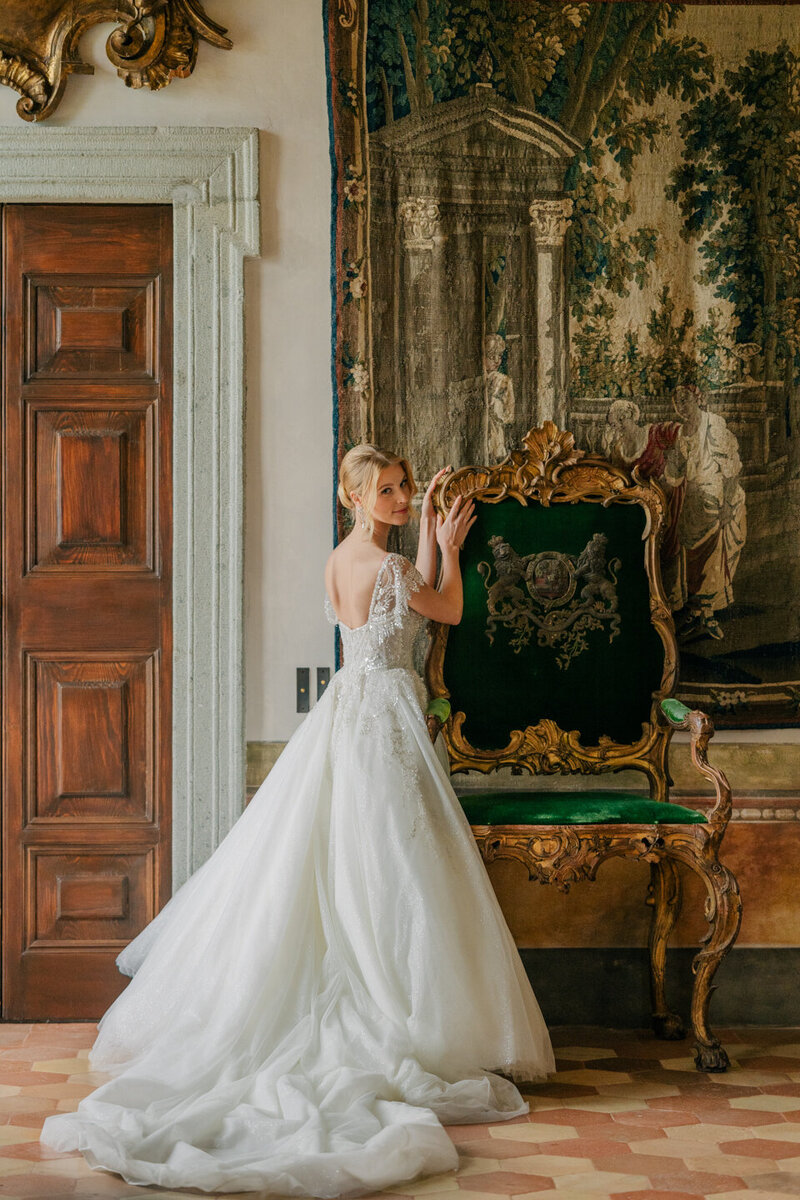 photo of bride standing next to antique chair taken by La Jolla elopement photography