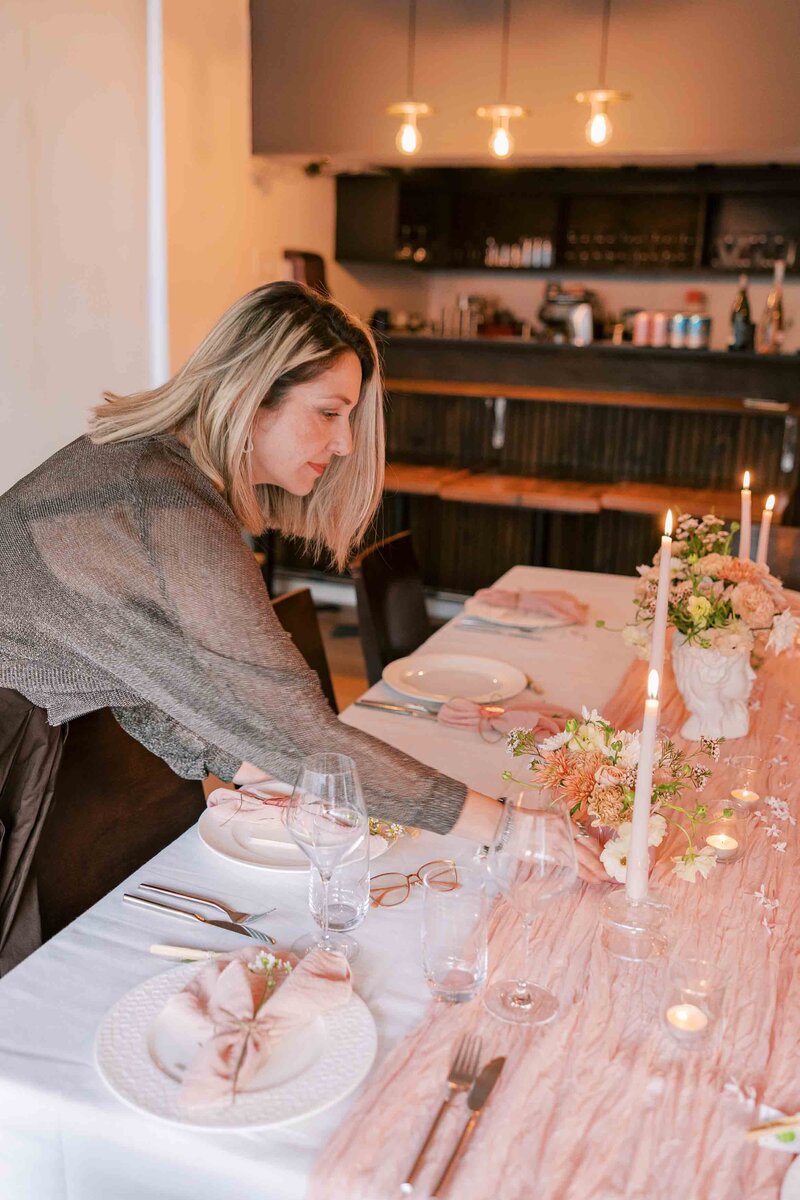 Einat Maron of Serendipity by Einat setting the table for dinner