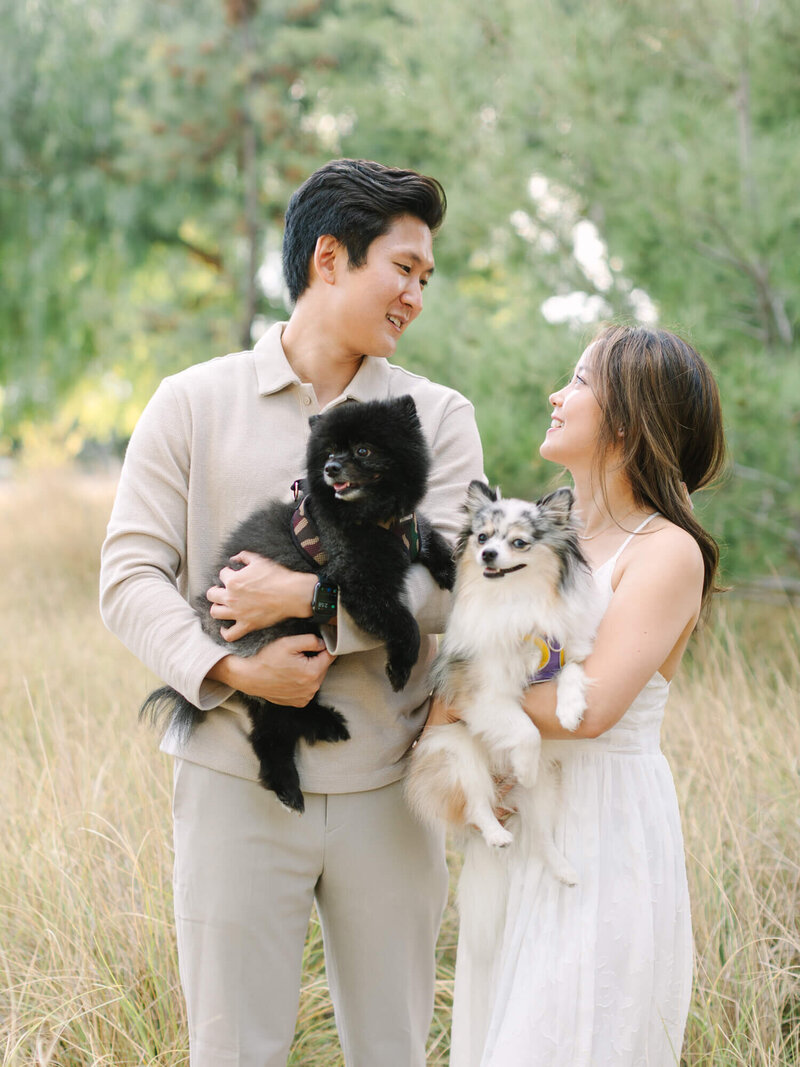 engagement photography at yorba linda regional park couple holding two dogs