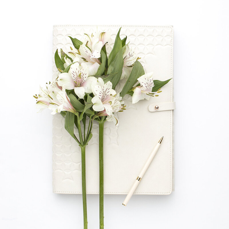 Career development notebook and flowers