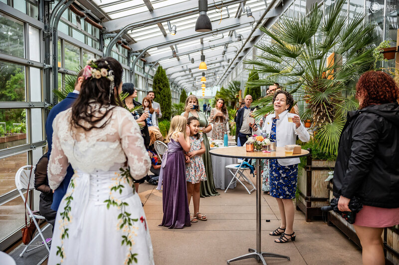 Wedding Toasts inside the Orangery at Denver Botanic Gardens