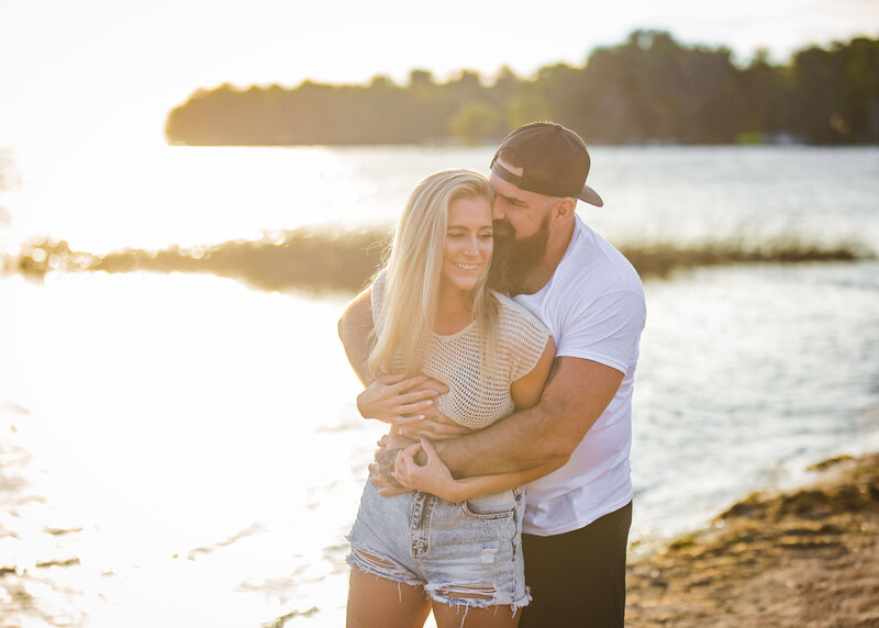 couple hugging at beach