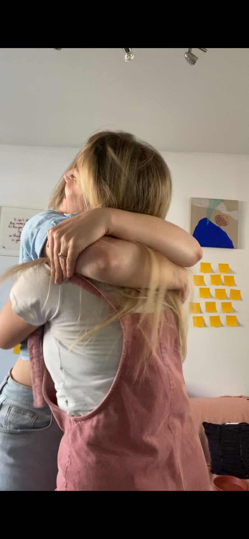 Claire Baker and Lauren Olivia Hughes hug