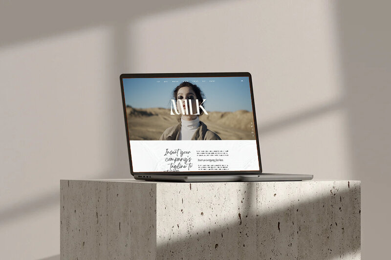 A woman sitting on the beach holding up a newspaper that says Reconnected is in session.