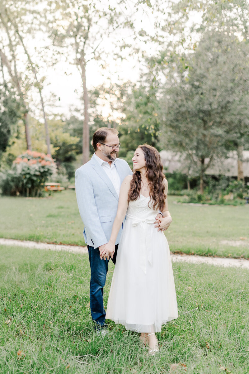 photo of a couple holding hands and smiling