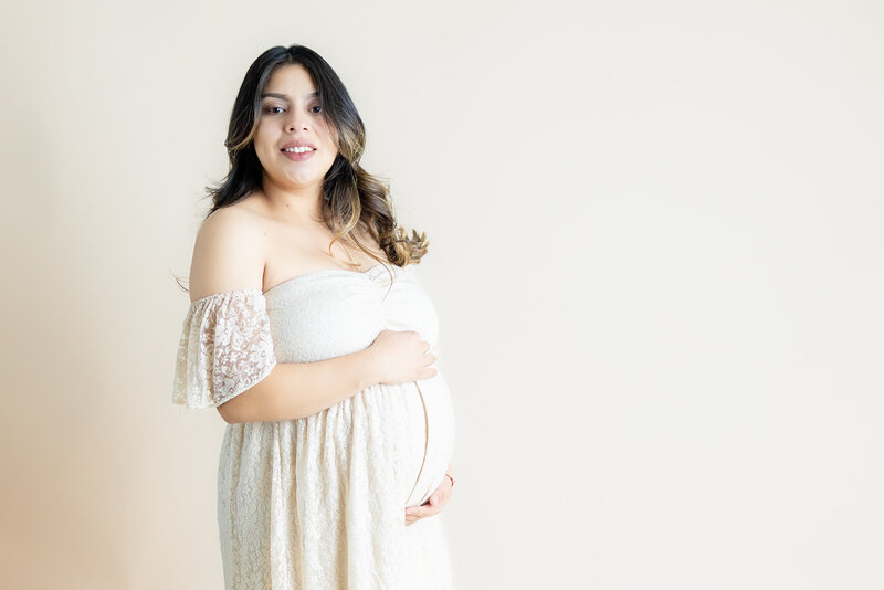 Pregnant woman in studio at Motherhood Photography AZ