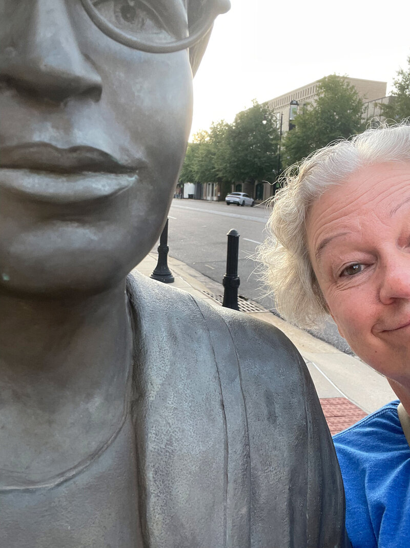 Joanne posing with a statue